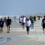 Crowds flock to Jacksonville beaches amid record COVID-19 cases