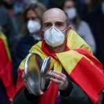 Spain’s daily COVID-19 deaths below 100 for first time in two months