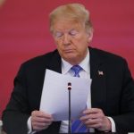 President says he still hopes coronavirus ‘will disappear’ as US death toll closes in on 130,000 amid surge in infections
