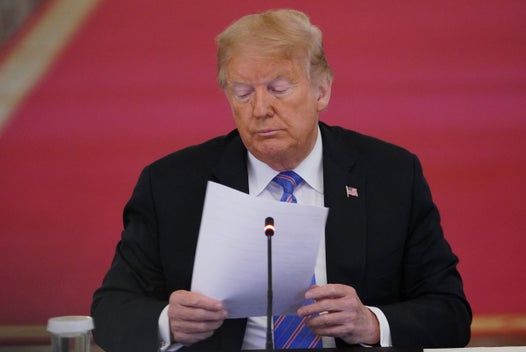 President says he still hopes coronavirus ‘will disappear’ as US death toll closes in on 130,000 amid surge in infections