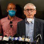 Wisconsin businesses sue governor over COVID-19 outbreak list