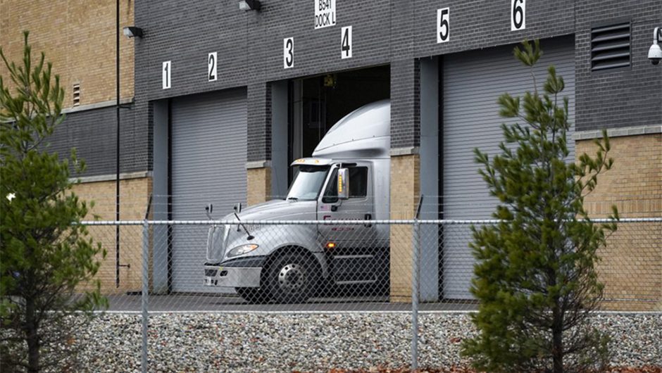 Pfizer trucks stand ready to roll out first COVID-19 vaccine