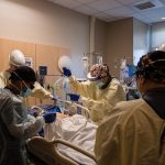 COVID-19 cases spike in US even as vaccination pace picks up