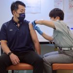 Japan to limit hospital care as COVID-19 cases hit new high