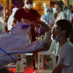 China imposes local lockdowns as COVID-19 cases surge