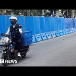 China police install barriers in Shanghai in effort to curb Covid protests – BBC News