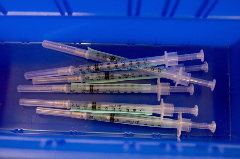 US CDC panel urges broad use of updated COVID-19 vaccines